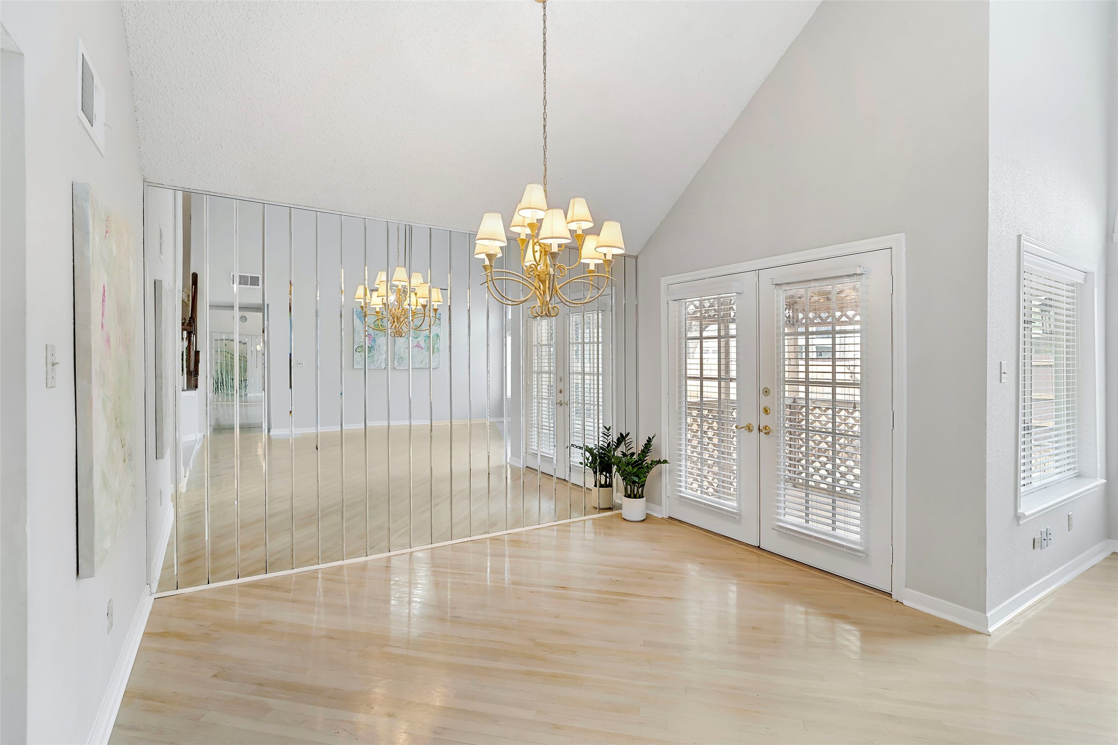 12800 Briar Forest Drive, Unit 48 Houston, TX 77077 - Photo 6 of 36 a view of an empty room with chandelier and window