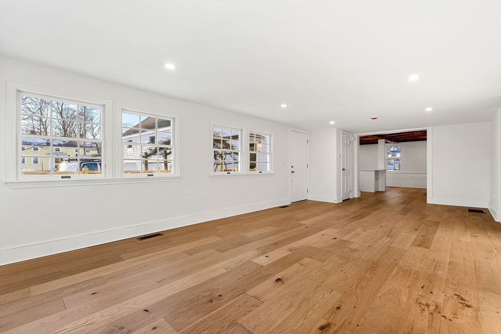 34 Central Street, Unit 1 Rowley, MA 01969 - Photo 14 of 27 a view of empty room with wooden floor and window