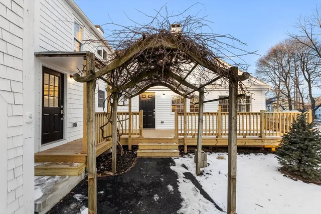 a view of a house with a small yard