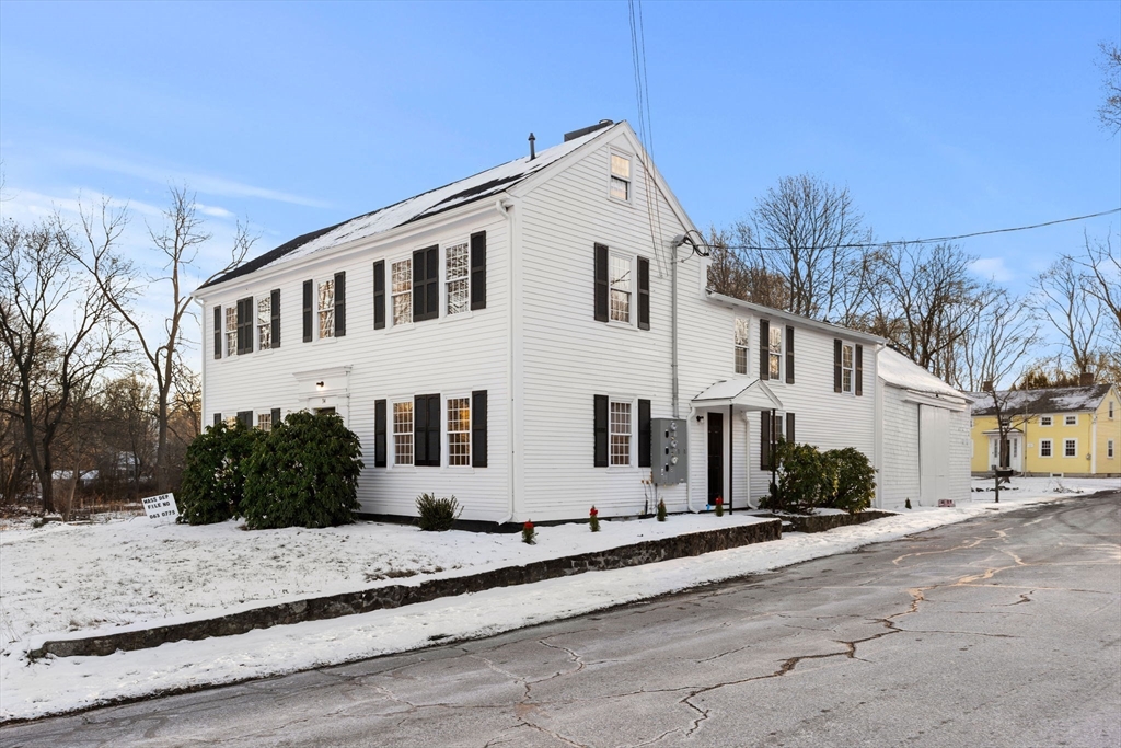 34 Central Street, Unit 1 Rowley, MA 01969 - Photo 4 of 27 a view of a white house with a yard