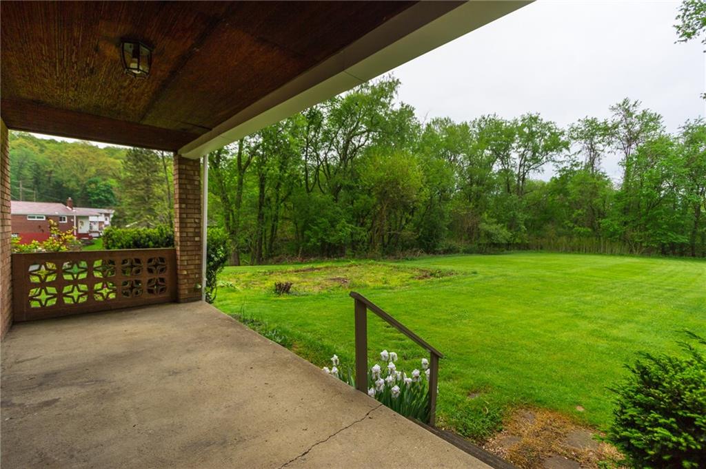 1153 Pentland Avenue Rochester, PA 15074 - Photo 19 of 23 Large back covered patio overlooking the private flat double lot.