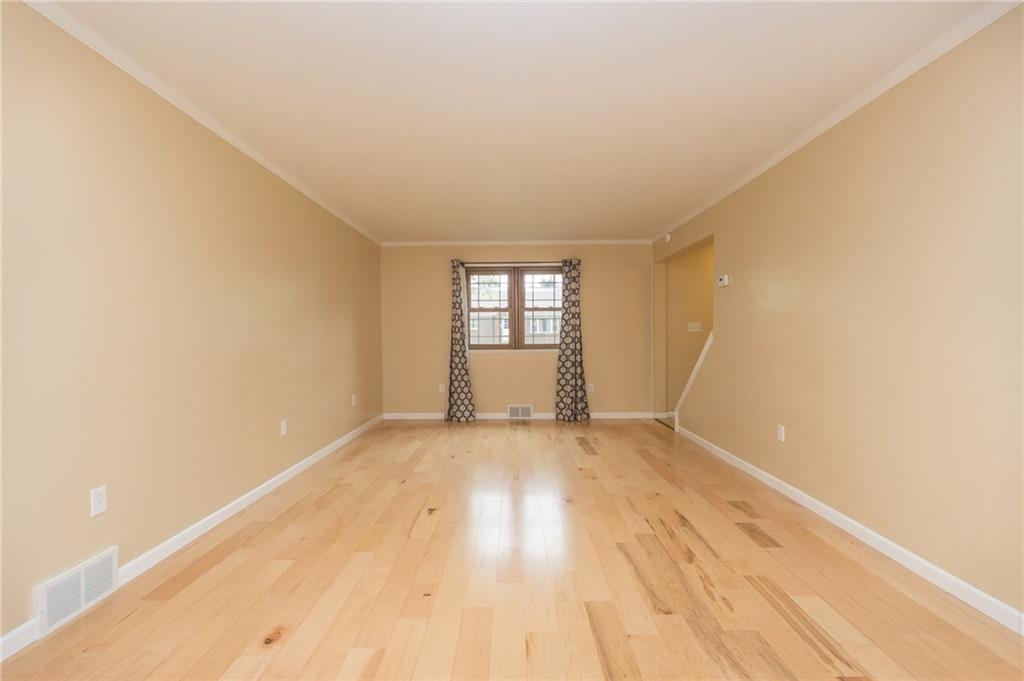 1153 Pentland Avenue Rochester, PA 15074 - Photo 4 of 23 Off the entry is a grand sized living room freshly painted with new hardwood floors.