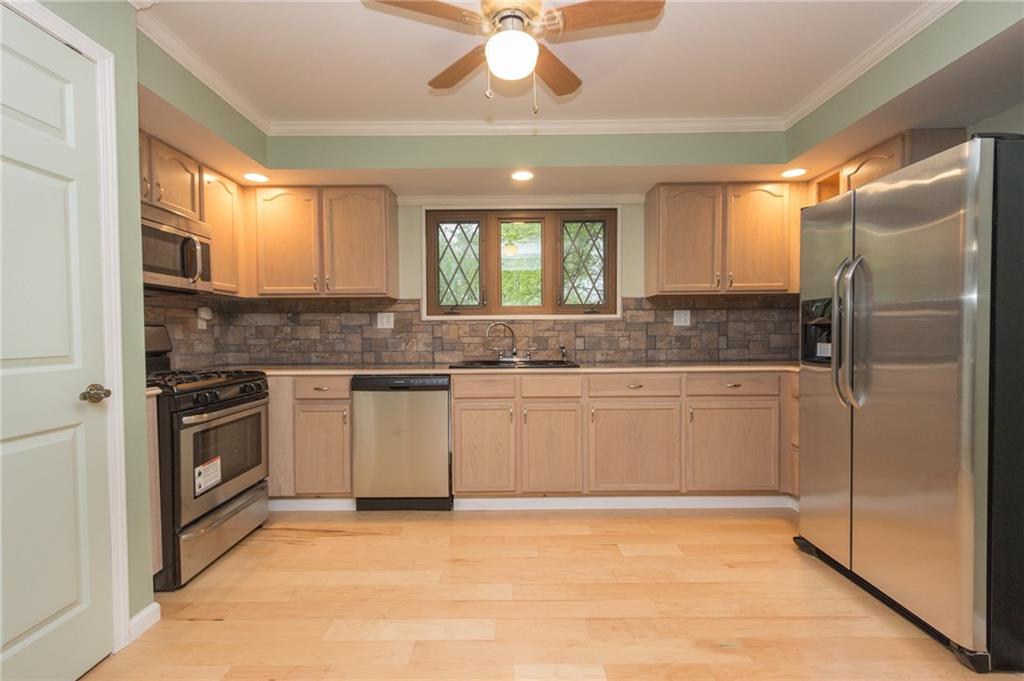 1153 Pentland Avenue Rochester, PA 15074 - Photo 7 of 23 This beautifully renovated kitchen will not disappoint. Complete with new hardwood flooring, all new cabinetry, granite counter tops, backsplash and new stainless steel appliances.