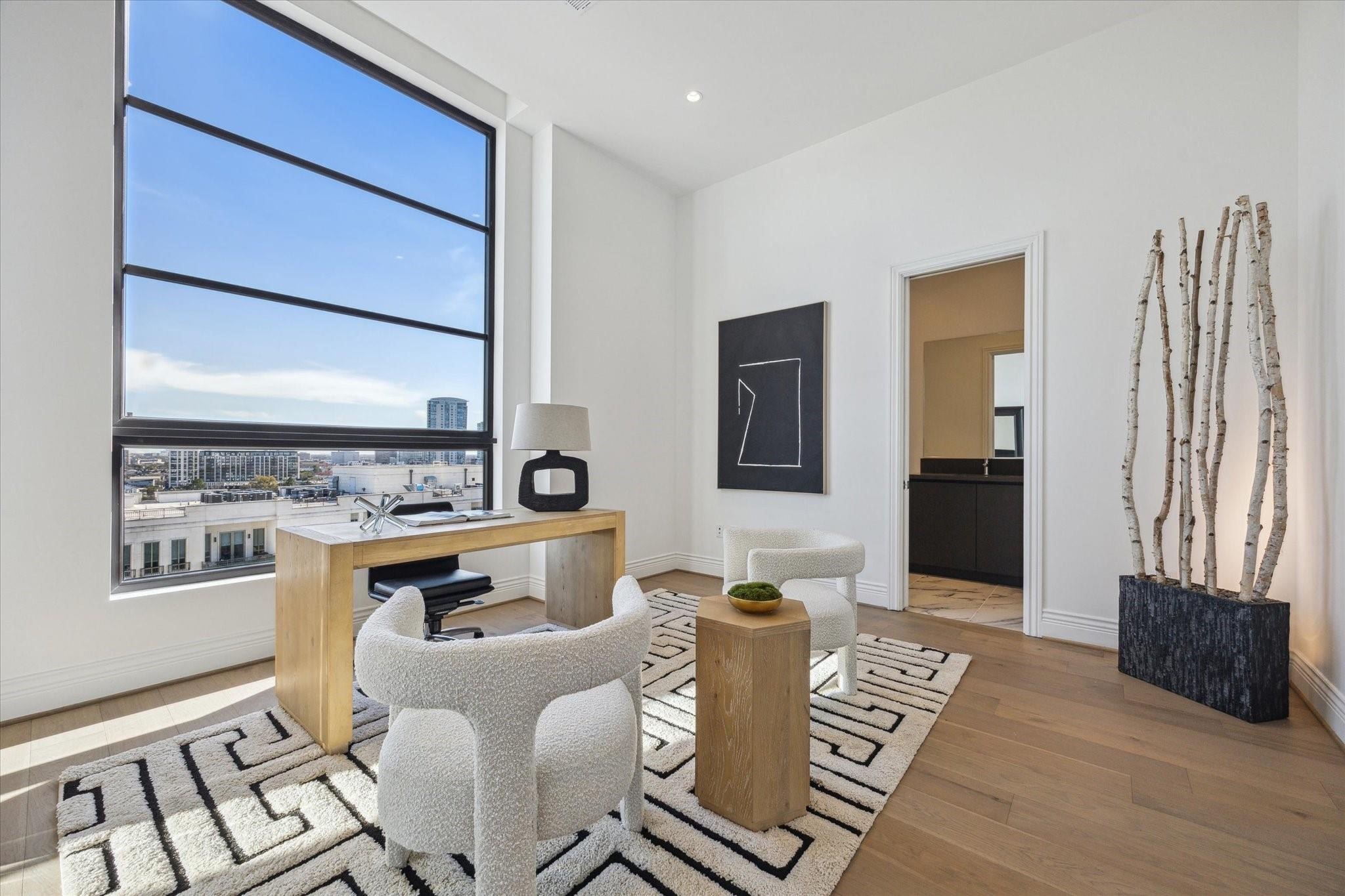 2360 Rice Boulevard, Unit PH1201 Houston, TX 77005 - Photo 17 of 21 a living room with furniture a wooden floor and a large window