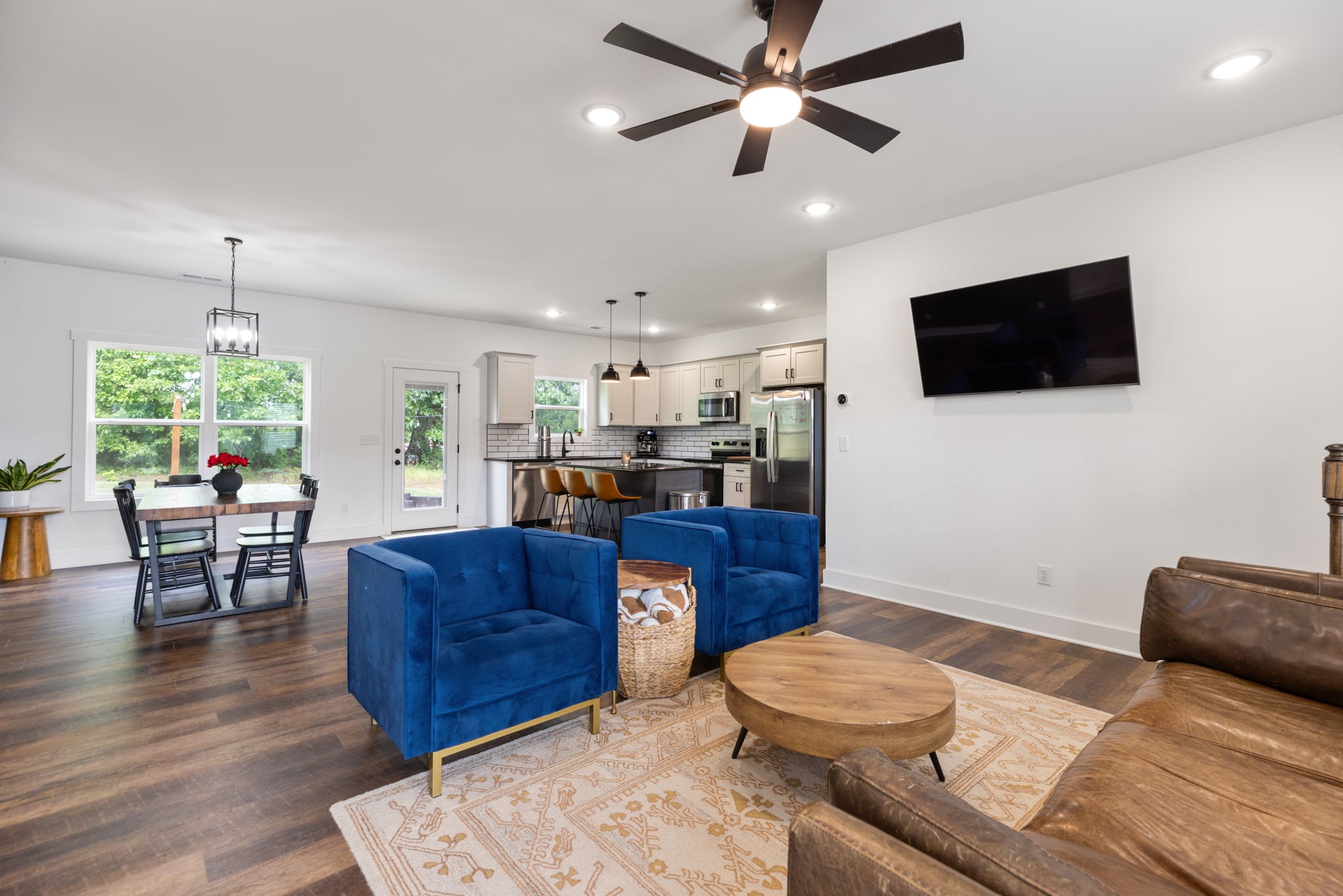 1578 Angus Way Greenbrier, TN 37073 - Photo 10 of 45 a living room with furniture a flat screen tv and a dining table