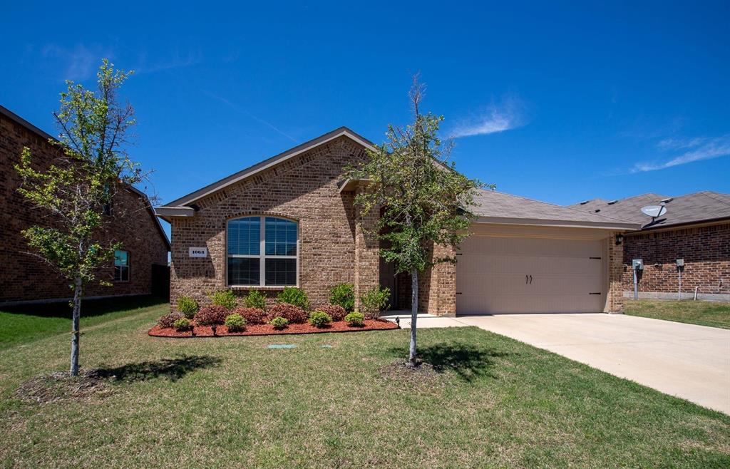 1063 Decker Drive Fate, TX 75189 - Photo 1 of 1 a front view of a house with a yard
