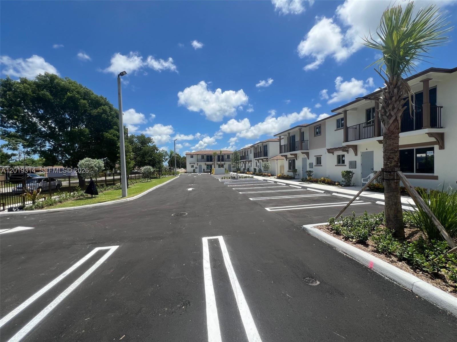 199 Redland Road, Unit B5 Florida City, FL 33034 - Photo 4 of 15 a view of a street with houses