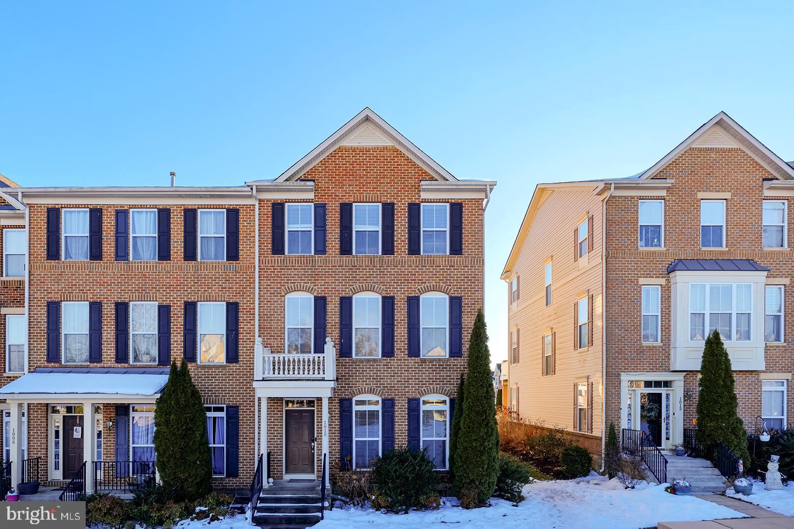 1010 Verdigris Way Odenton, MD 21113 - Photo 1 of 38 a front view of a residential apartment building with a yard