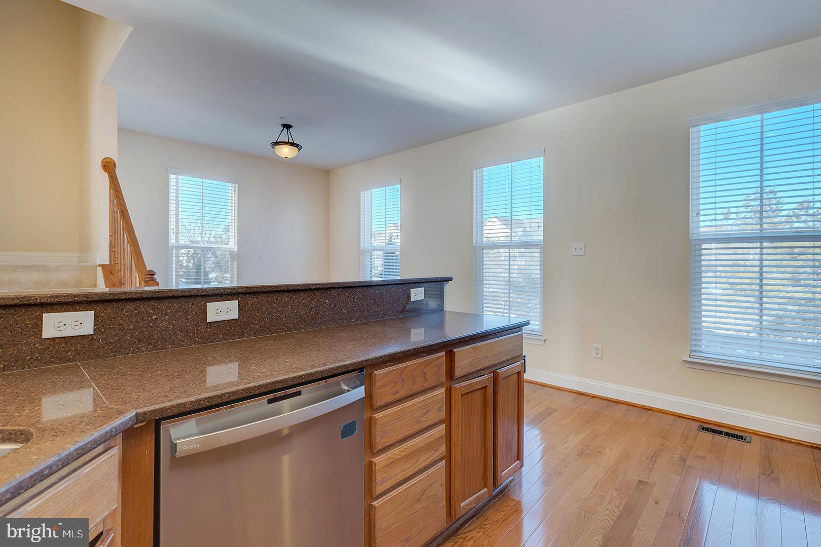 1010 Verdigris Way Odenton, MD 21113 - Photo 11 of 38 a view of a kitchen counter space with wooden floor