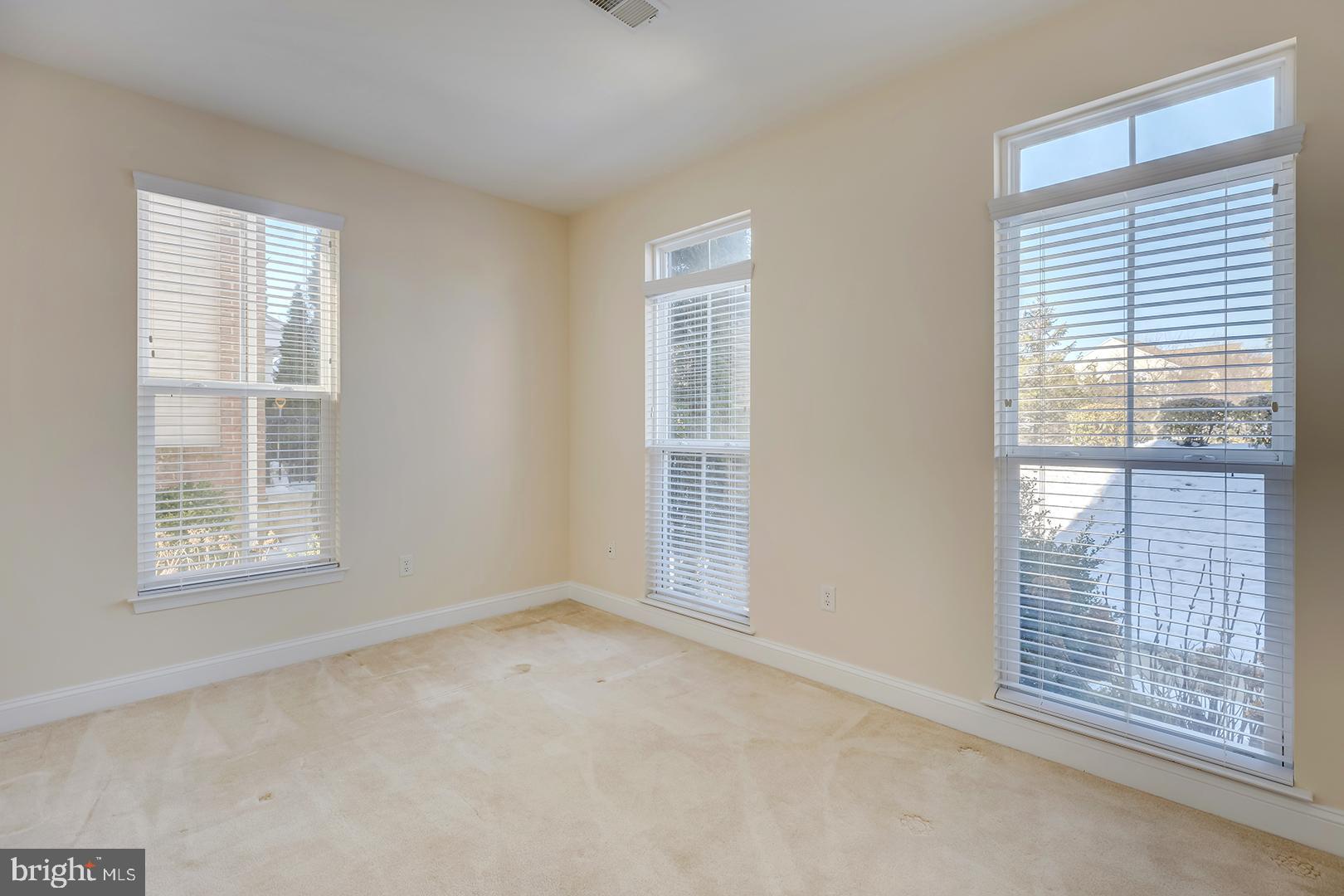 1010 Verdigris Way Odenton, MD 21113 - Photo 14 of 38 an empty room with windows