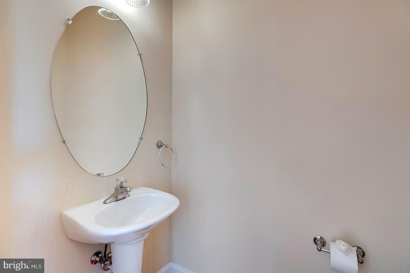 1010 Verdigris Way Odenton, MD 21113 - Photo 16 of 38 a bathroom with a sink and a mirror