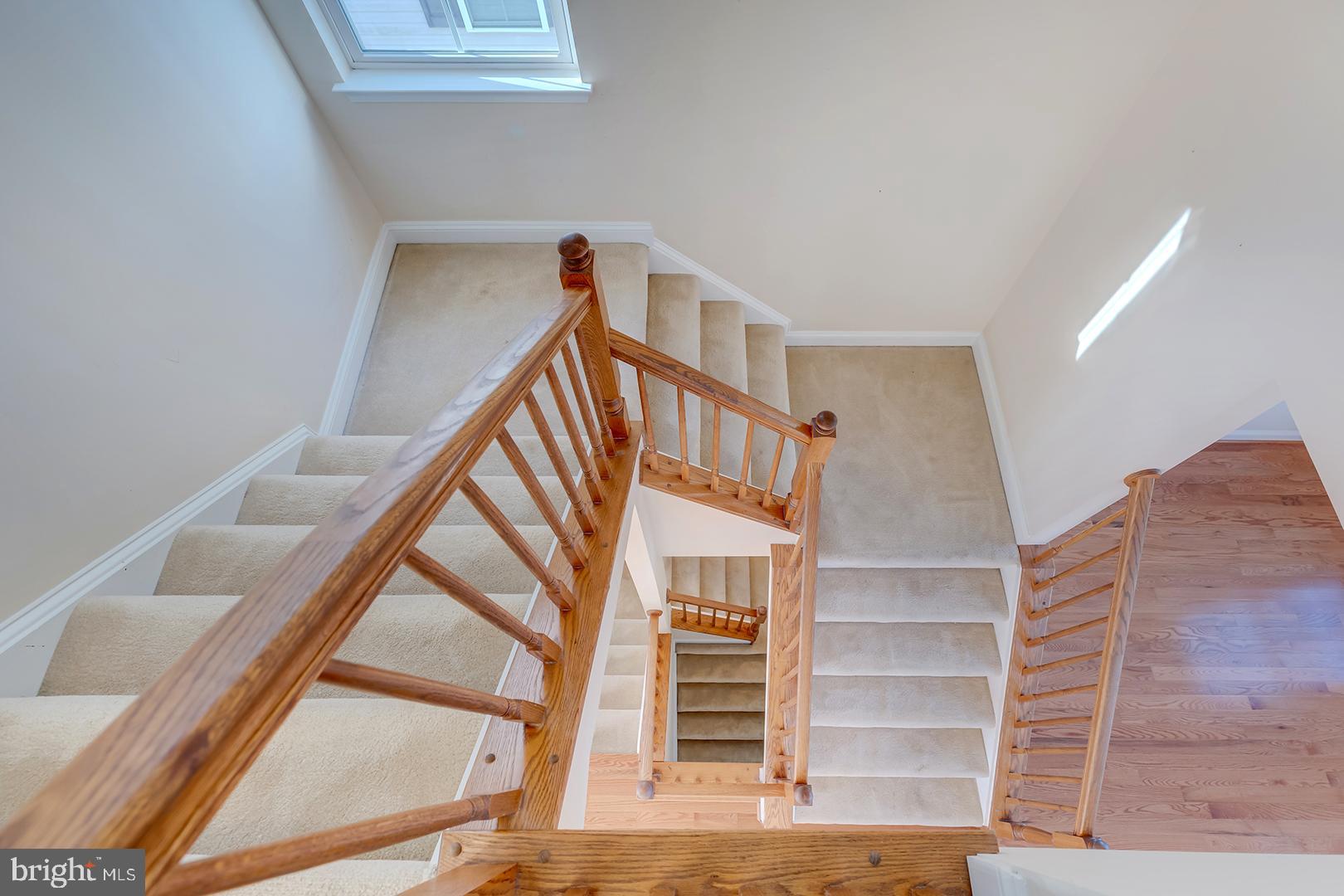 1010 Verdigris Way Odenton, MD 21113 - Photo 18 of 38 a view of staircase with railing and white walls