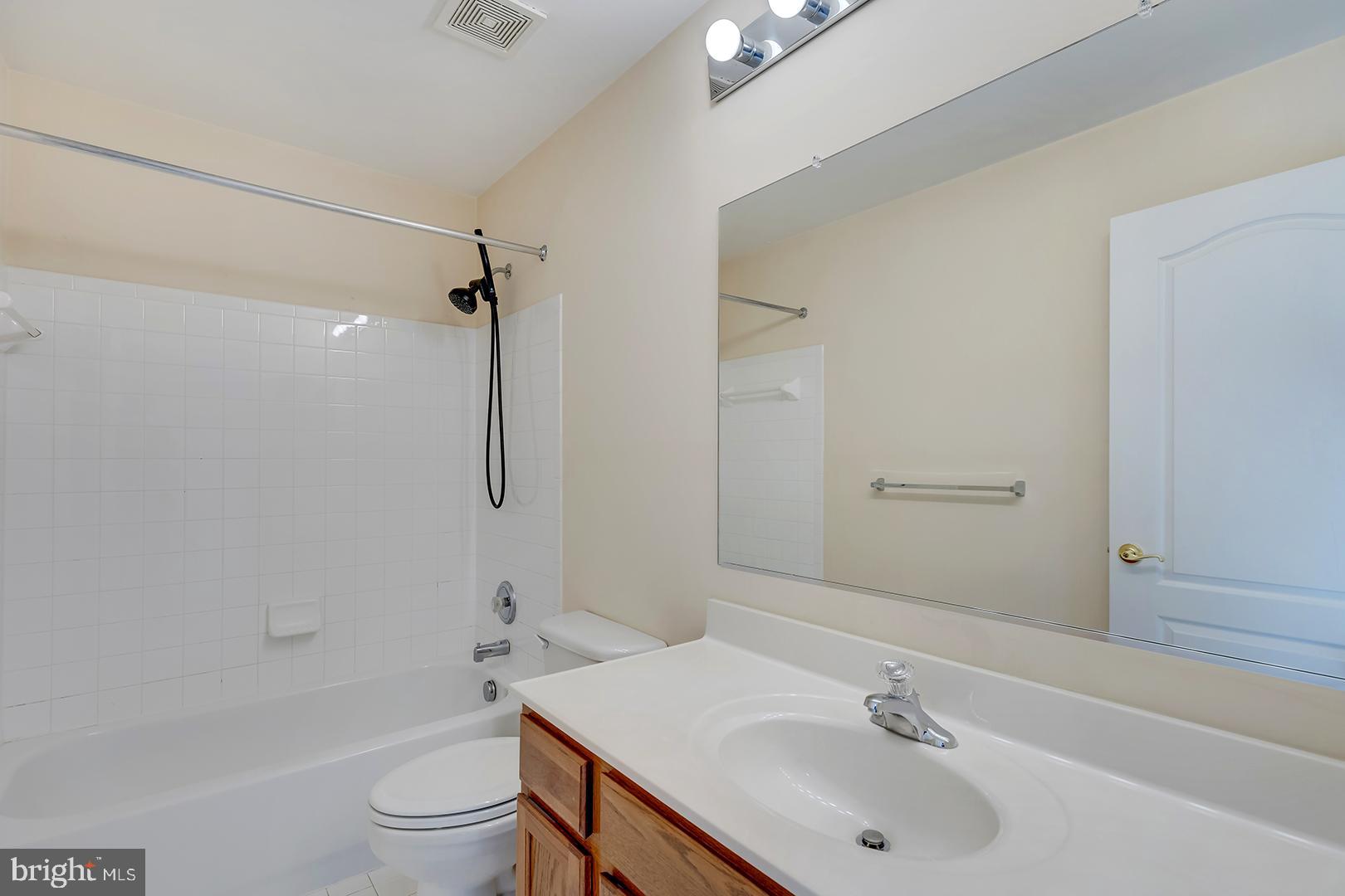 1010 Verdigris Way Odenton, MD 21113 - Photo 23 of 38 a bathroom with a sink toilet and shower