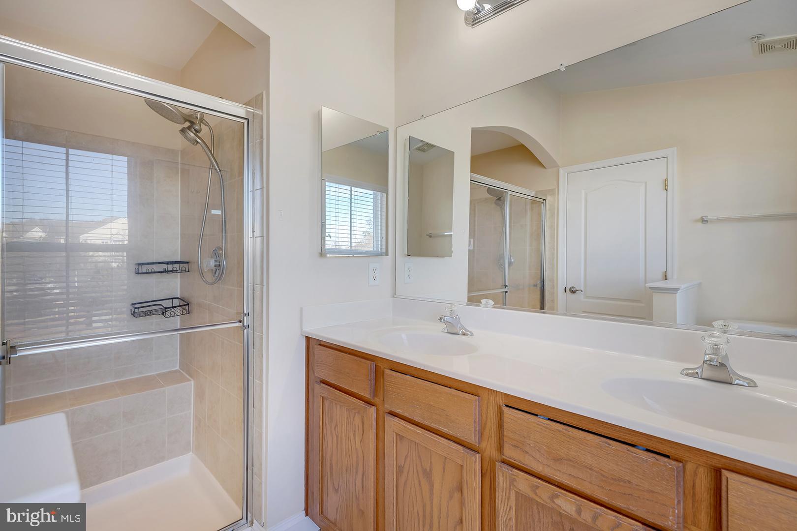 1010 Verdigris Way Odenton, MD 21113 - Photo 27 of 38 a bathroom with a sink and a mirror