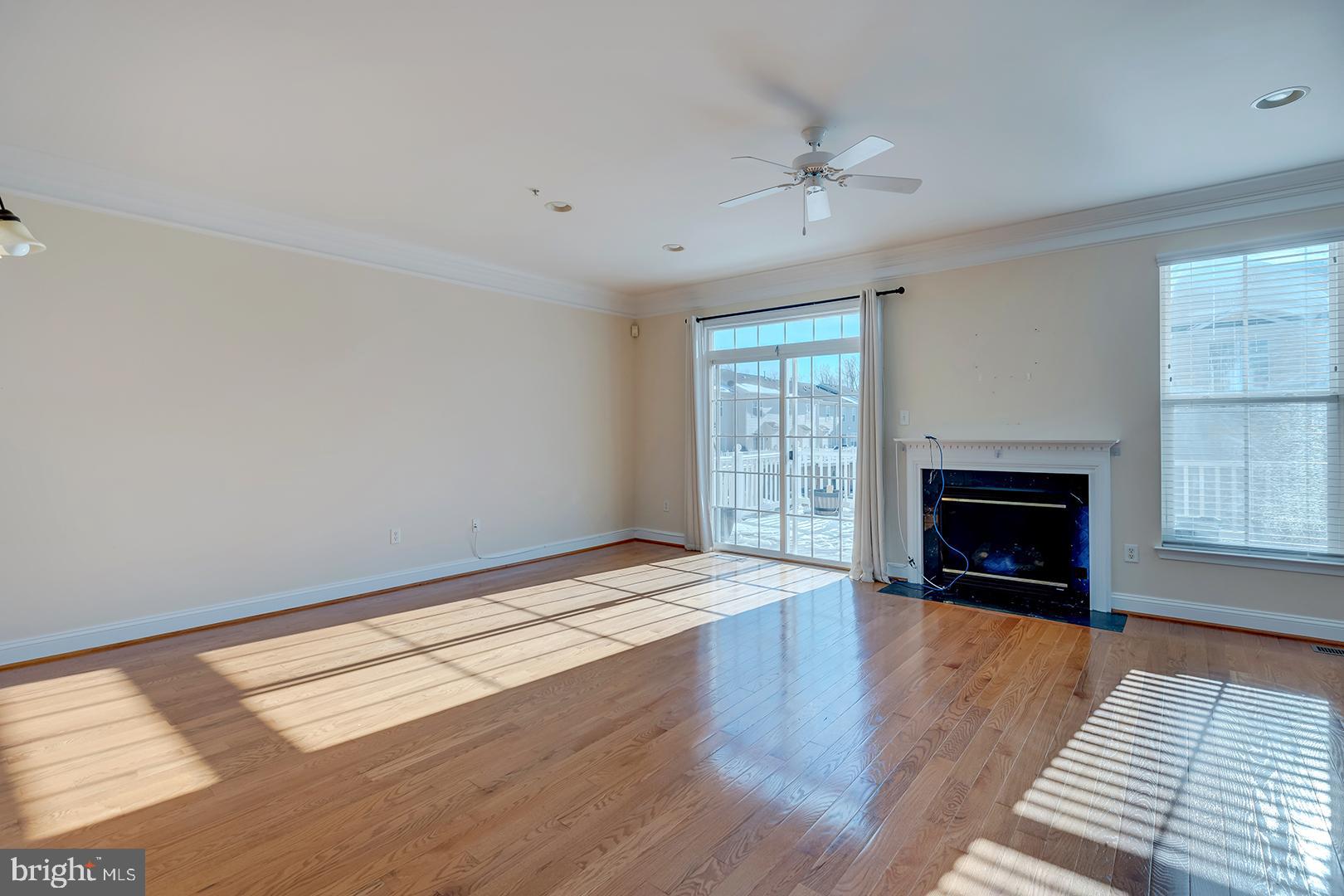 1010 Verdigris Way Odenton, MD 21113 - Photo 3 of 38 a view of an empty room with a fireplace and a window