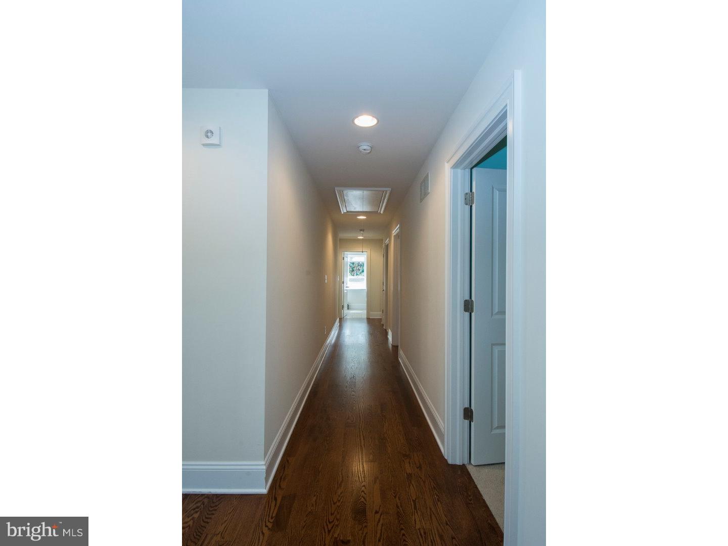 427 Iven Avenue Wayne, PA 19087 - Photo 13 of 24 a view of a hallway with wooden floor