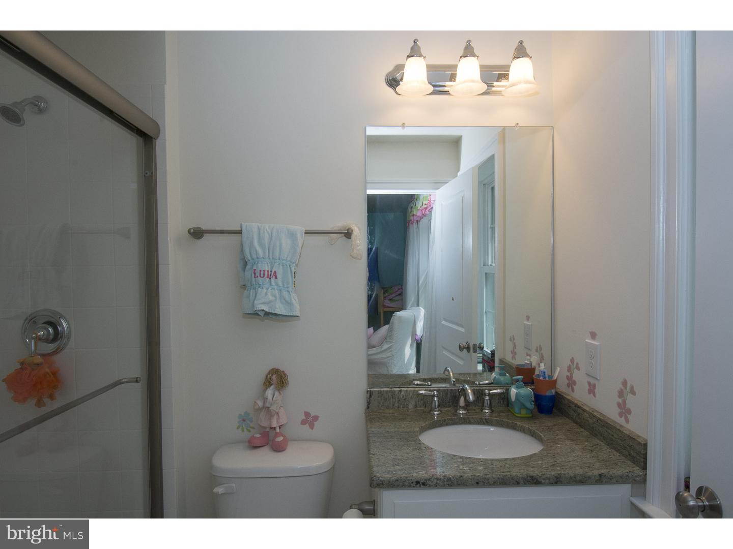 427 Iven Avenue Wayne, PA 19087 - Photo 18 of 24 a bathroom with a sink and a mirror