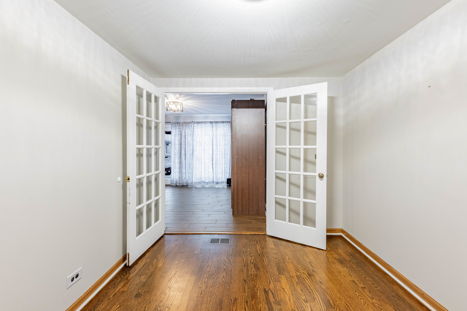8912 South Ryan Road Hometown, IL 60456 - Photo 19 of 23 an empty room with wooden floor and windows