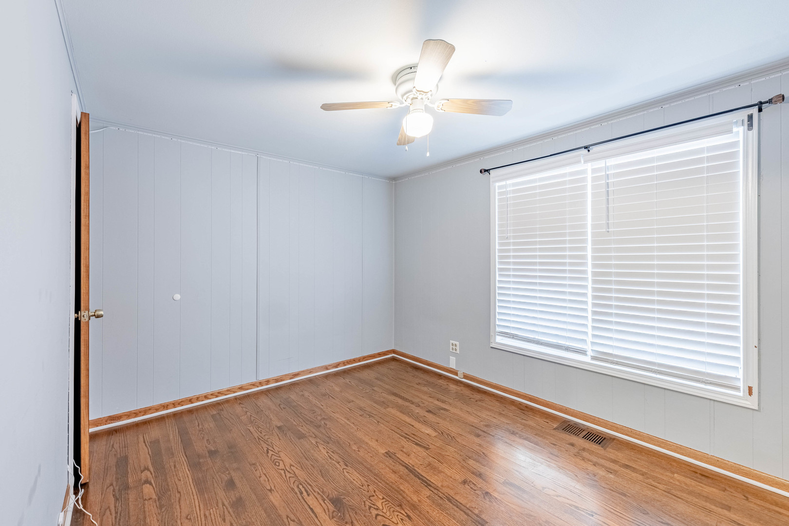 8912 South Ryan Road Hometown, IL 60456 - Photo 20 of 23 wooden floor in an empty room with a window