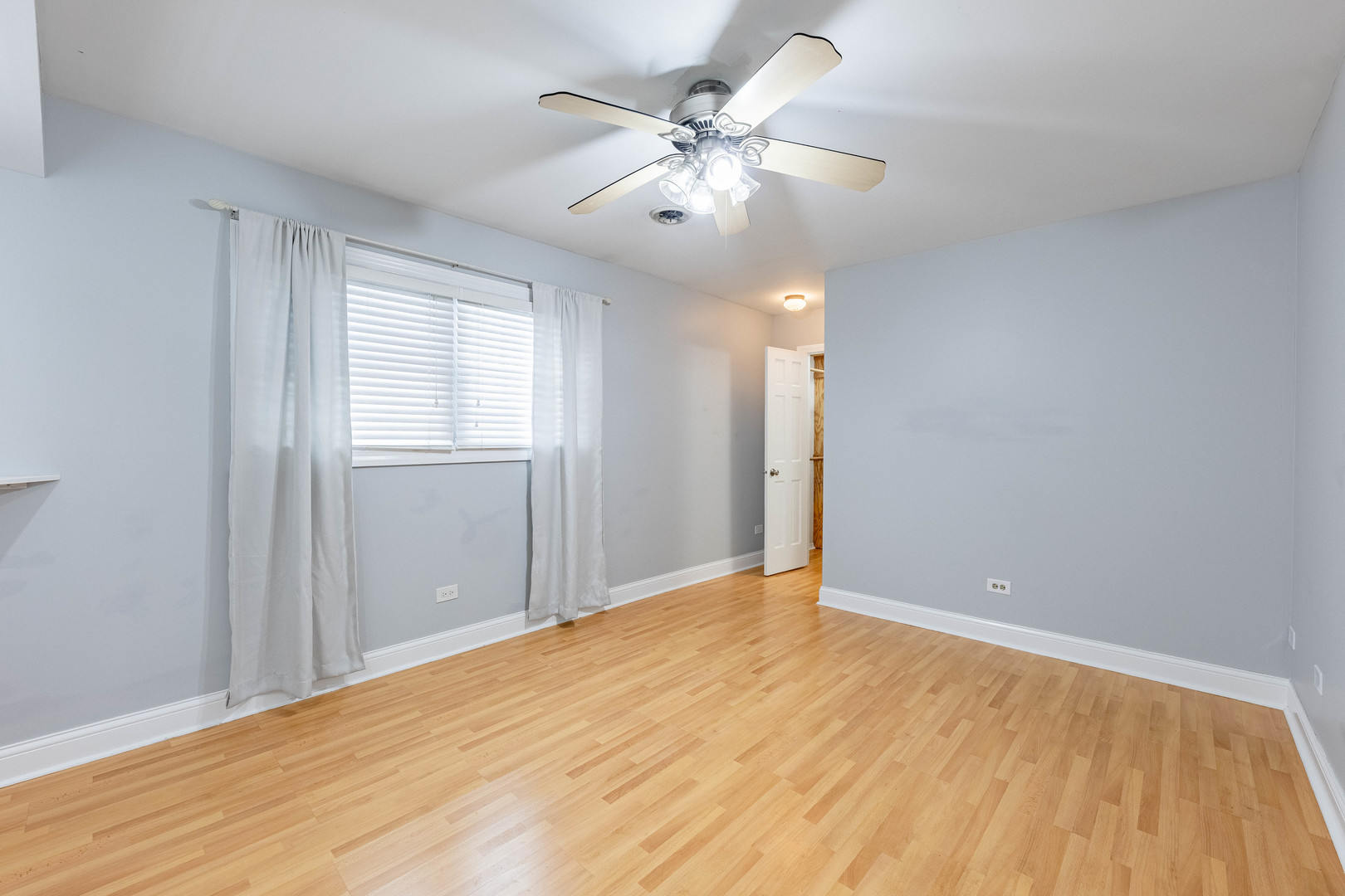 8912 South Ryan Road Hometown, IL 60456 - Photo 4 of 23 a view of an empty room with wooden floor