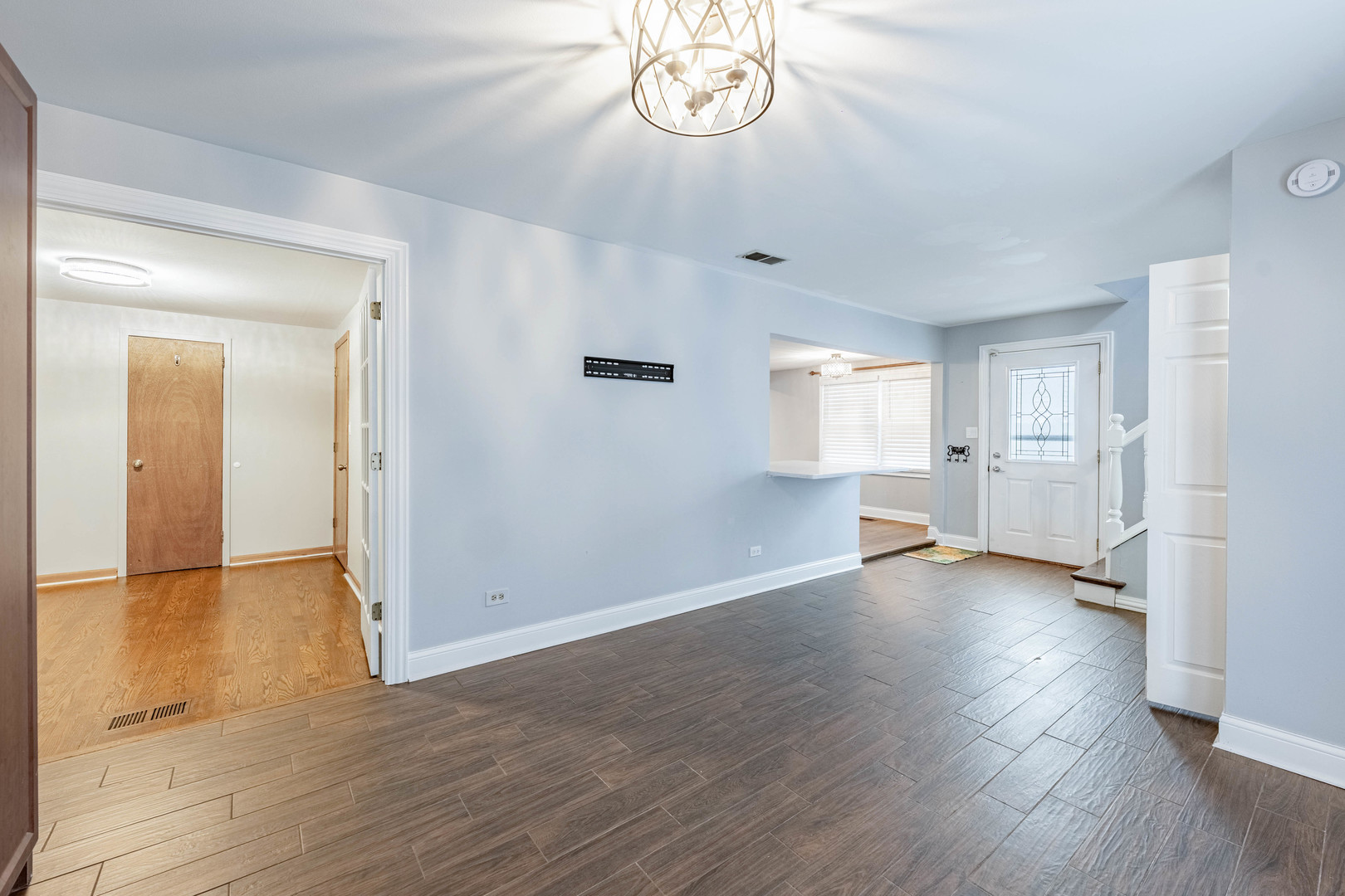 8912 South Ryan Road Hometown, IL 60456 - Photo 8 of 23 an empty room with wooden floor mirror and windows