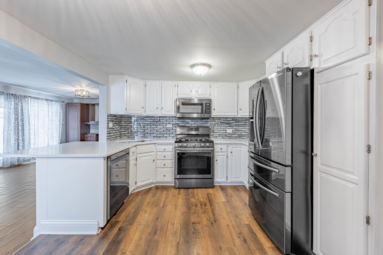 8912 South Ryan Road Hometown, IL 60456 - Photo 9 of 23 a kitchen with a refrigerator and a stove top oven