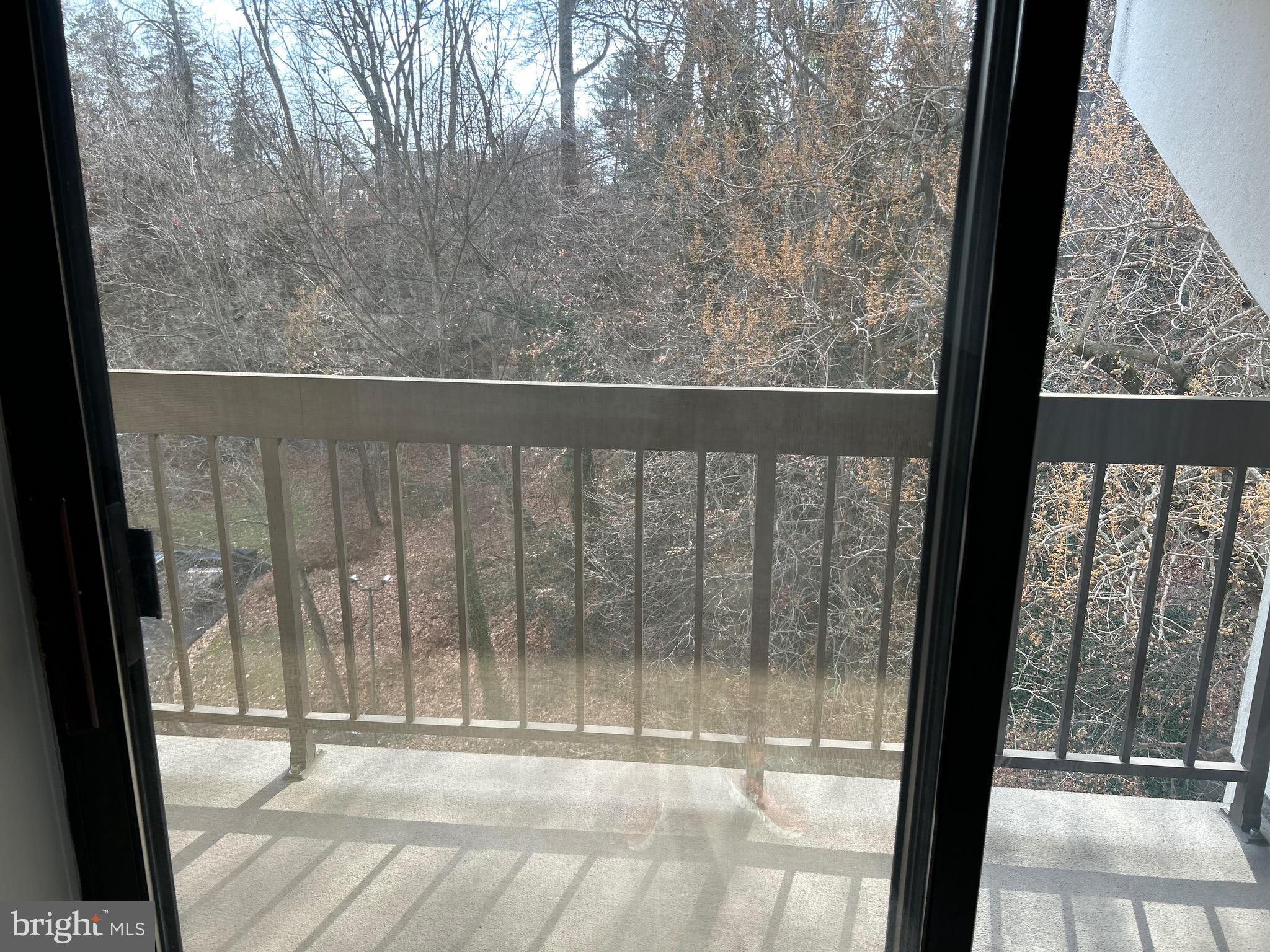 800 Avondale Road, Unit 7M Wallingford, PA 19086 - Photo 14 of 14 a view of a glass door with a yard