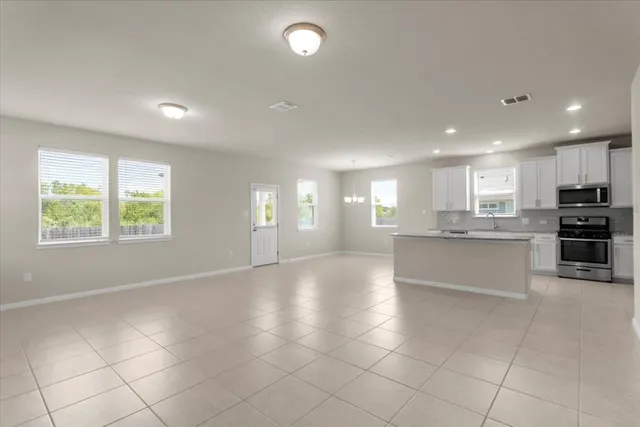an aerial view of a chairs and table with swimming pool