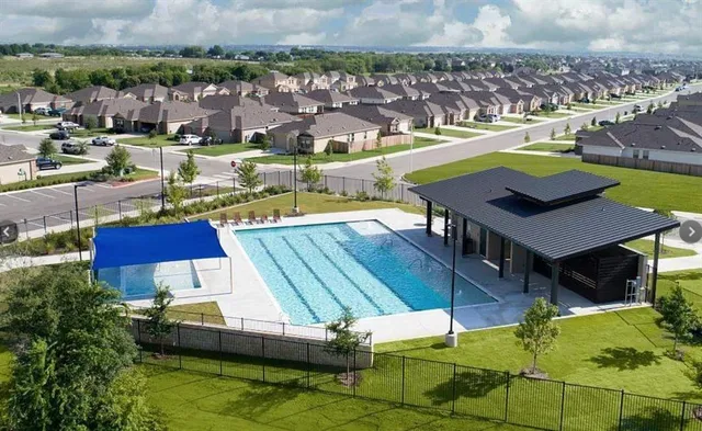 a view of a park with swings on the wall