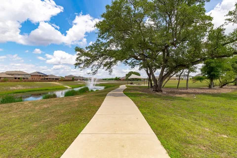 a view of lake with yard