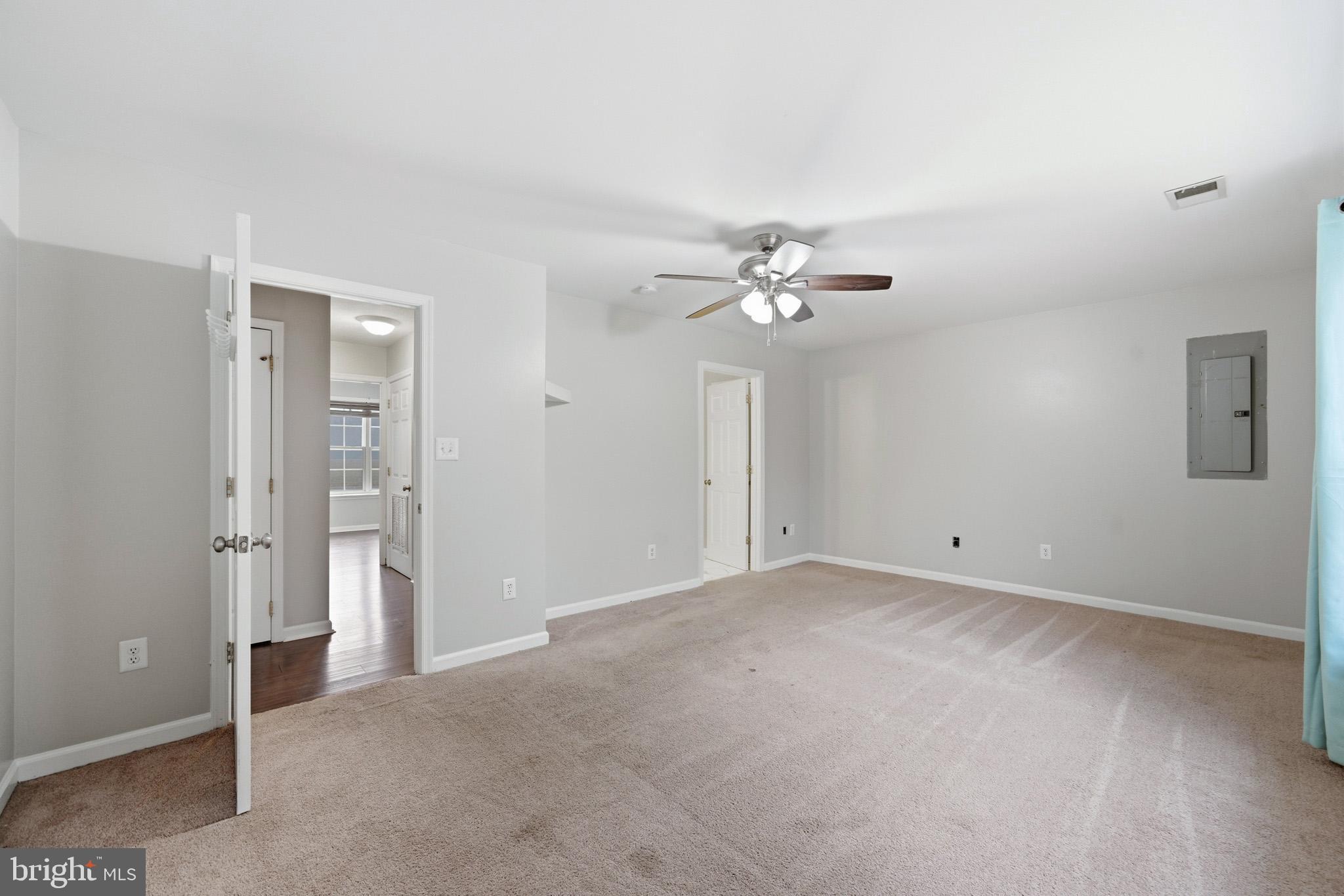 22343 Newtowne Neck Road Leonardtown, MD 20650 - Photo 24 of 40 a view of an empty room with a fan