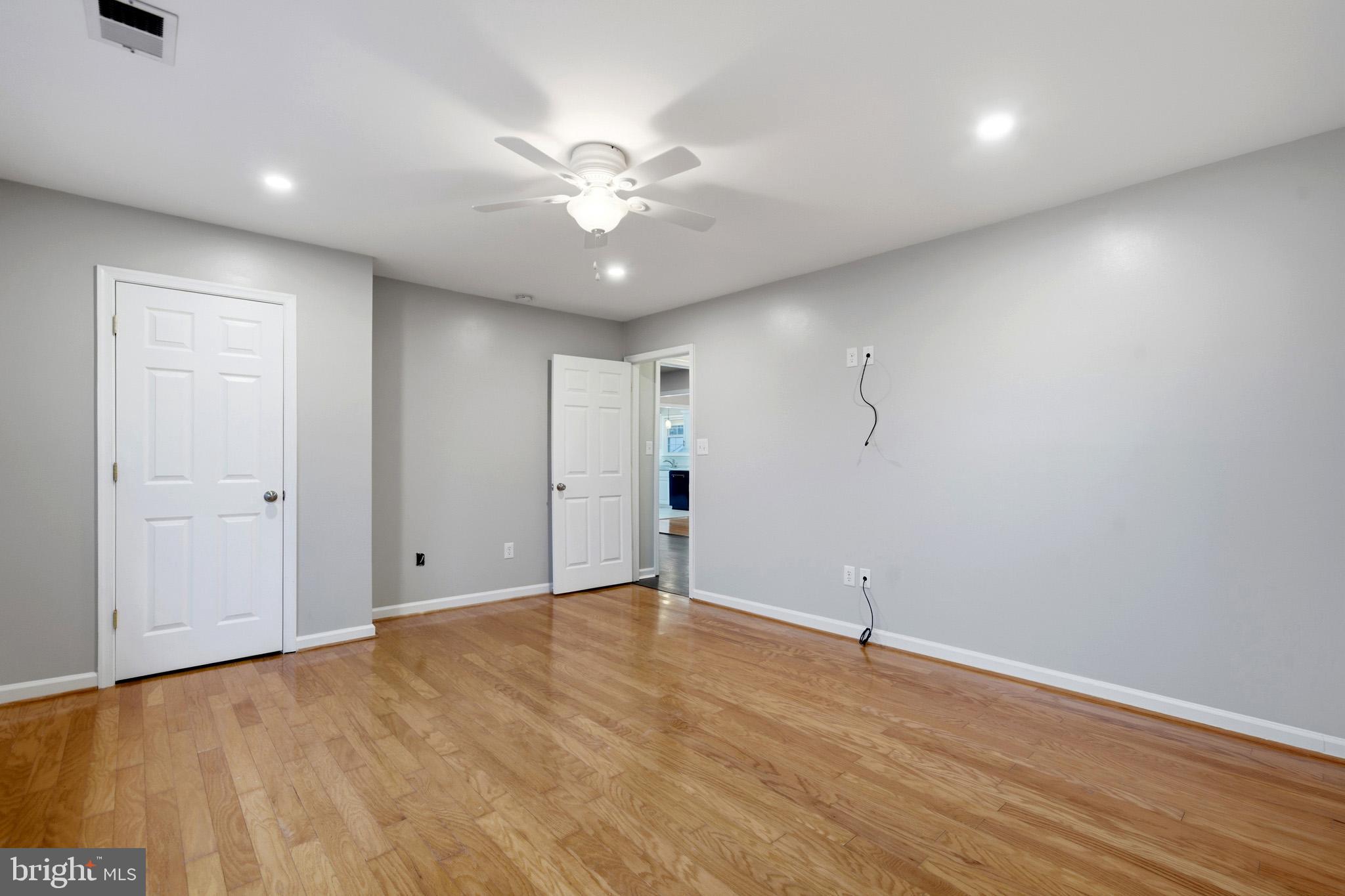 22343 Newtowne Neck Road Leonardtown, MD 20650 - Photo 37 of 40 wooden floor in an empty room with a window
