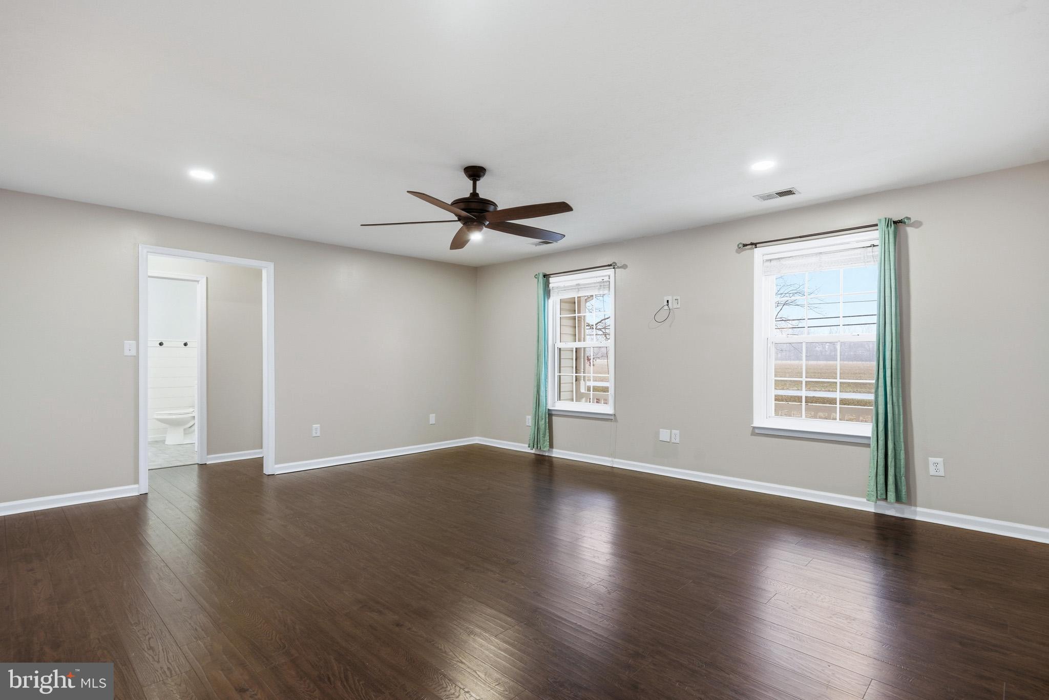 22343 Newtowne Neck Road Leonardtown, MD 20650 - Photo 10 of 40 a view of an empty room with wooden floor and a window