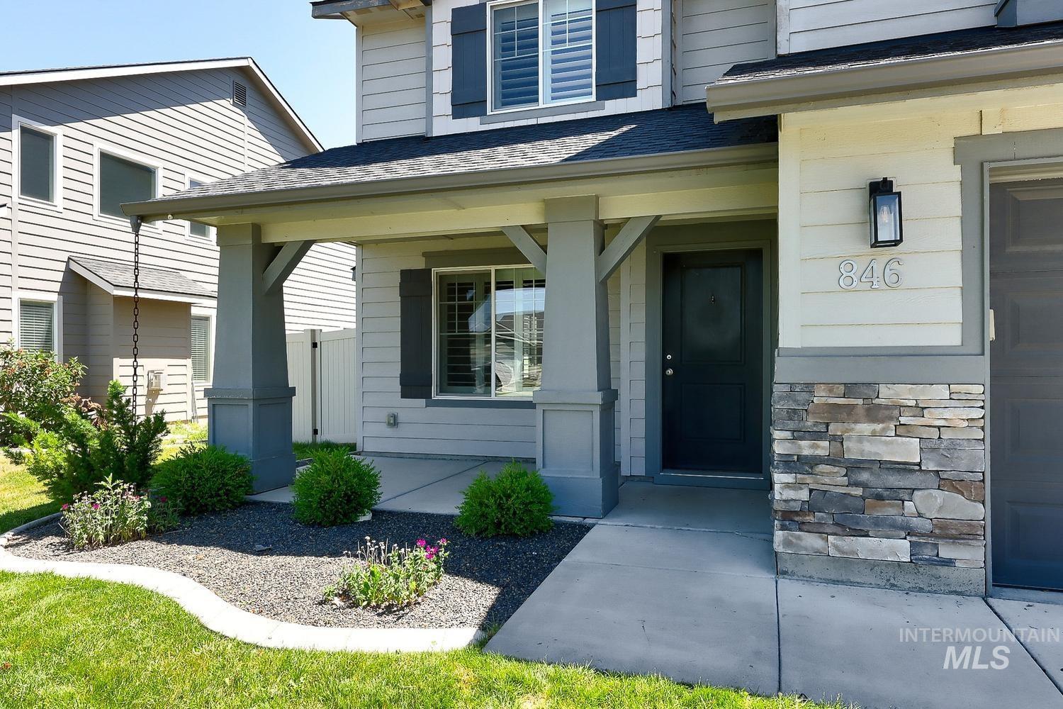 846 North Hidden View Way Star, ID 83669 - Photo 3 of 49 Contemporary exterior featuring light-toned siding with dark accents and stone veneer detailing