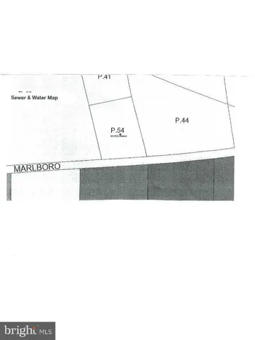 a picture of a room with a white wall and a large window