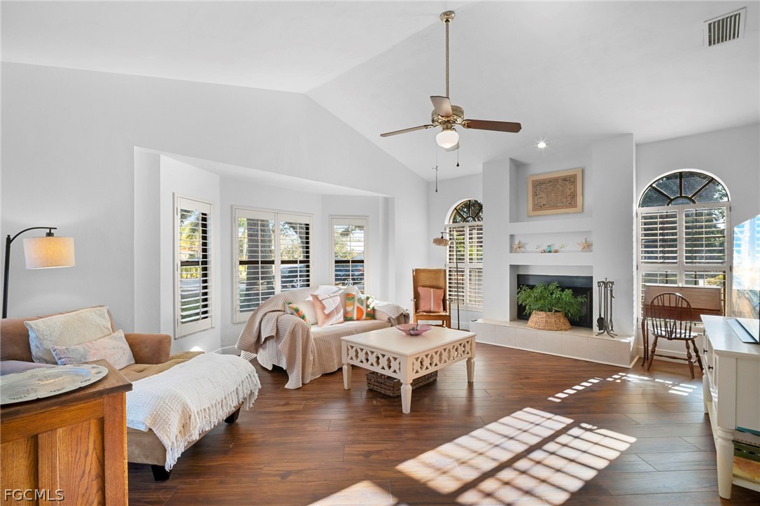 11772 Mahogany Run Fort Myers, FL 33913 - Photo 23 of 50 a living room with furniture and a fireplace