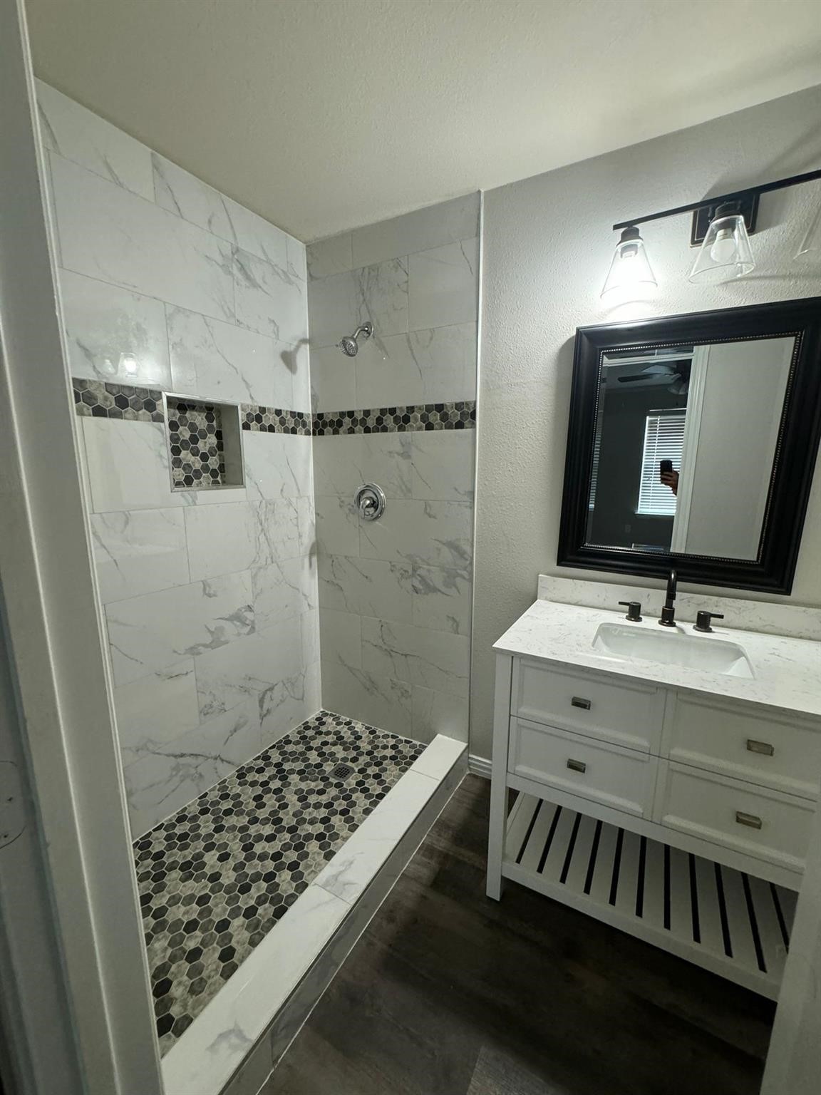 25614 Crisp Spring Lane Spring, TX 77373 - Photo 22 of 25 a bathroom with a sink and a mirror