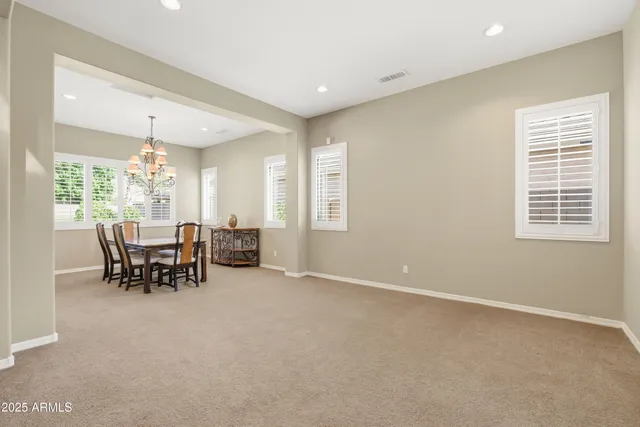 a kitchen with granite countertop stainless steel appliances granite countertop a sink a stove and cabinets