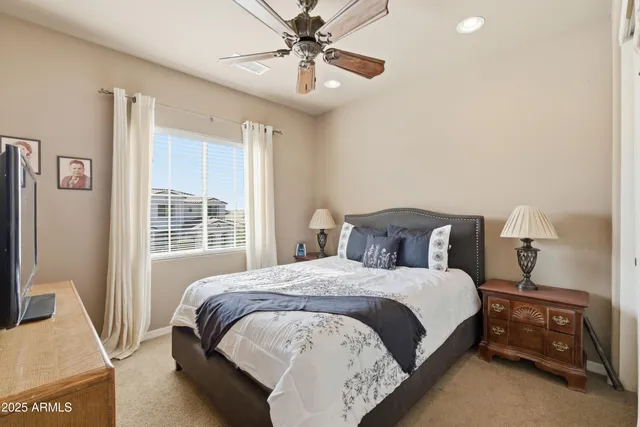 a view of a swimming pool with a patio and a yard