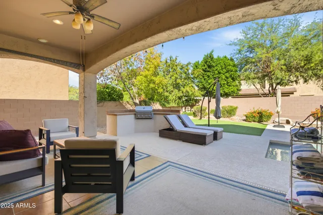 a view of a house with a backyard