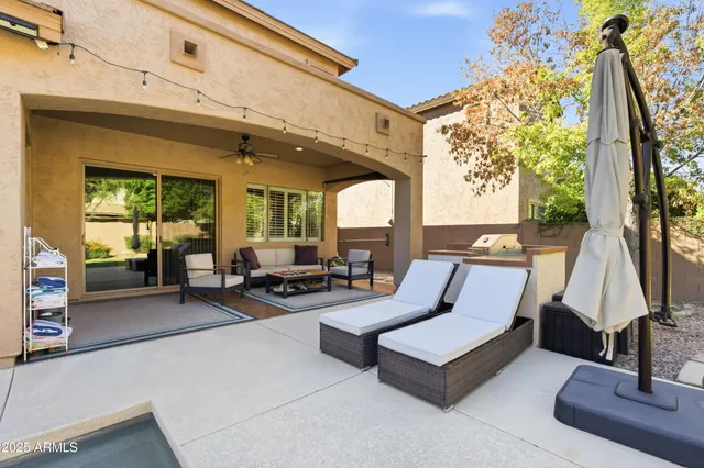 a front view of a house with a garden and yard