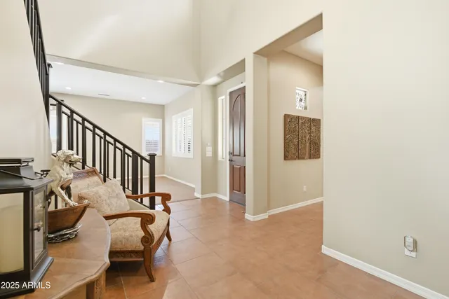 a kitchen with stainless steel appliances granite countertop a sink a stove and a wooden cabinets