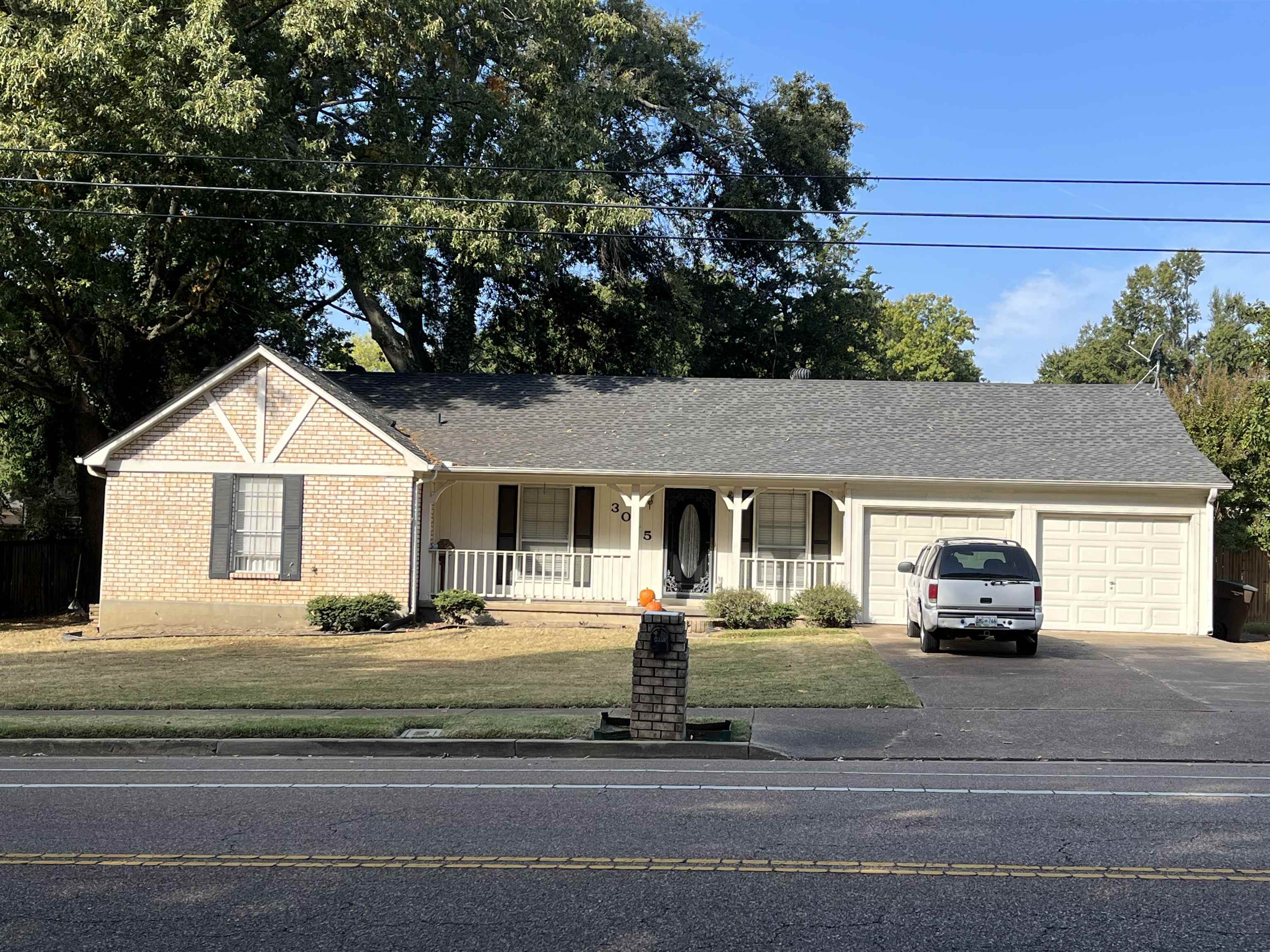 3045 Altruria Road Bartlett, TN 38134 - Photo 1 of 24 a car parked in front of white house