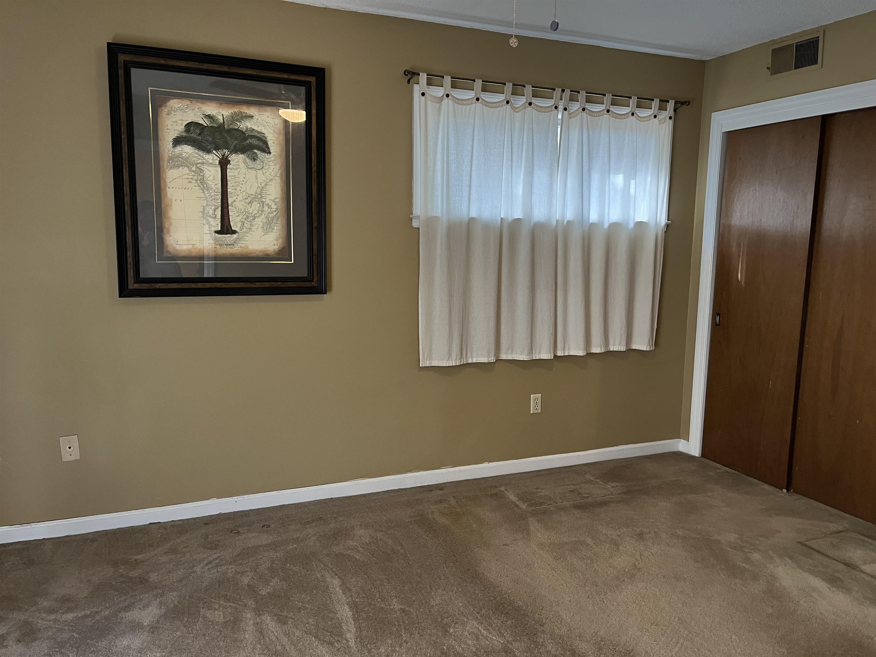 3045 Altruria Road Bartlett, TN 38134 - Photo 20 of 24 an empty room with wooden floor and a window