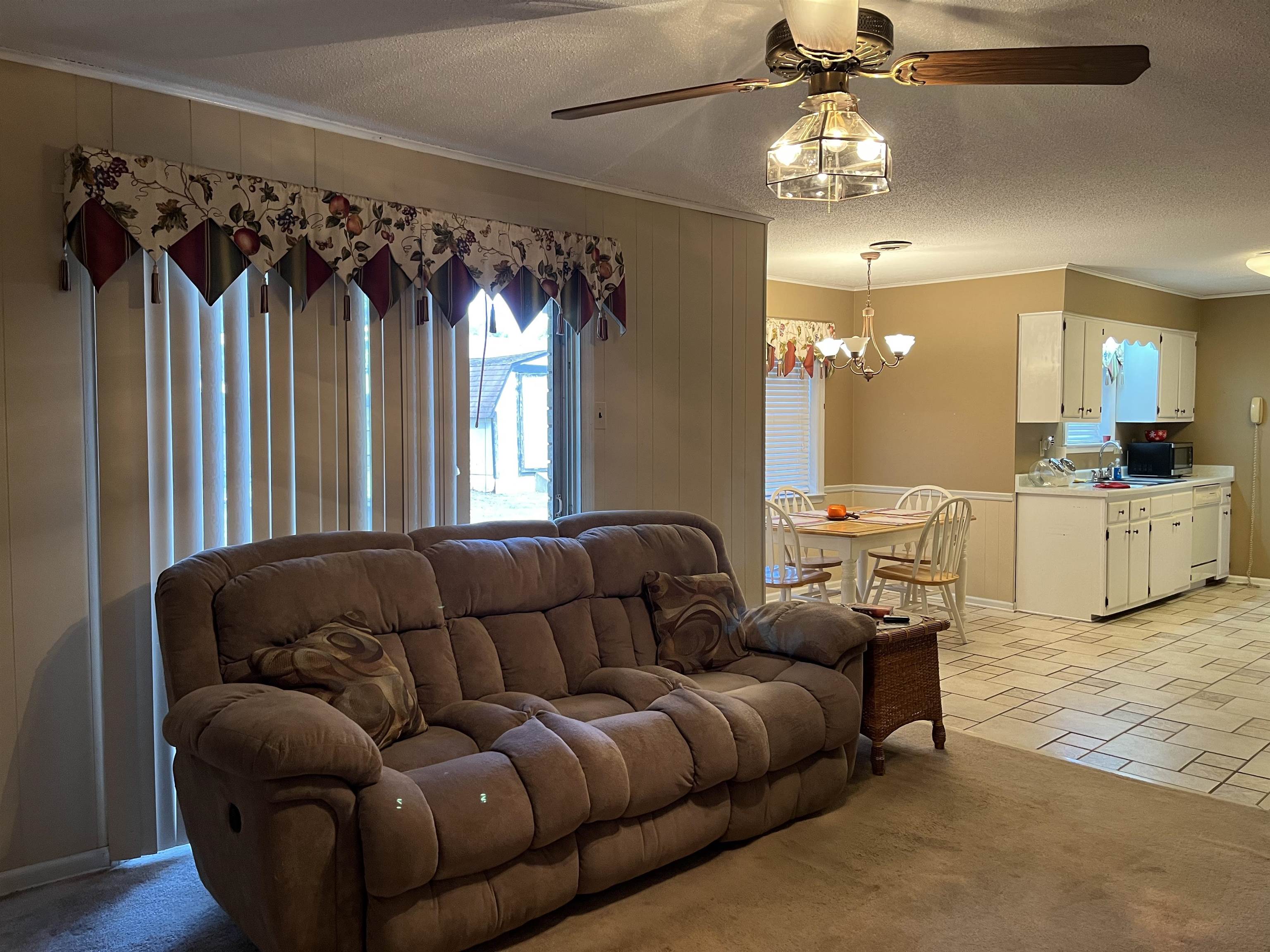 3045 Altruria Road Bartlett, TN 38134 - Photo 6 of 24 a living room with furniture and a chandelier