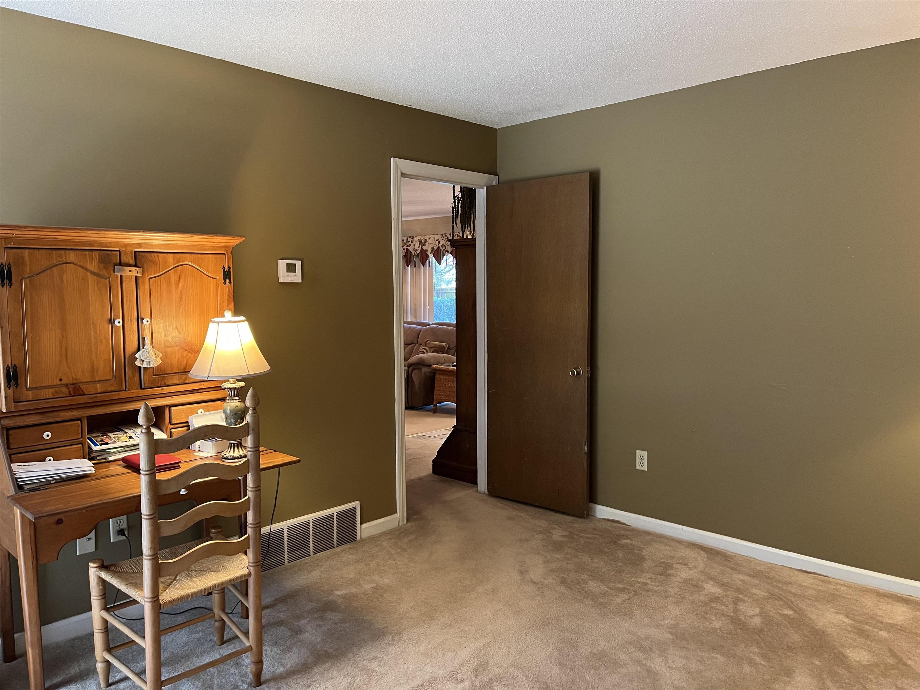 3045 Altruria Road Bartlett, TN 38134 - Photo 8 of 24 an empty room with wooden floor and windows