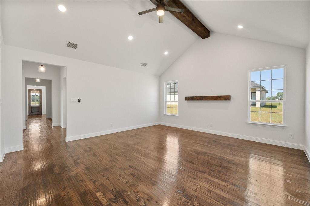 3400 Dobbins Road Corsicana, TX 75110 - Photo 5 of 40 an empty room with wooden floor and windows
