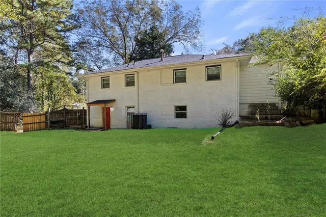 a view of a backyard with plants and a garden