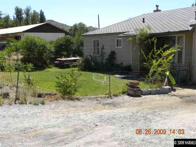 8945 Reservoir Street Reno, NV 89506 - Photo 2 of 2 a front view of a house with garden