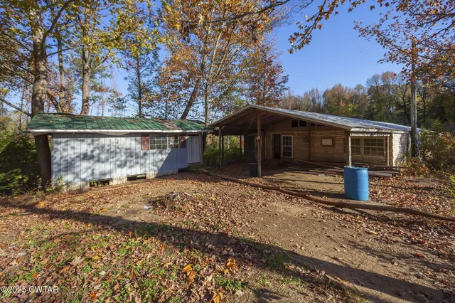 a view of a barn with a yard